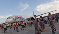 Air hostesses walk next to the parked Air India's Boeing 787-800 Dreamliner upon its arrival at the airport in New Delhi September 8, 2012. REUTERS/Mansi Thapliyal
