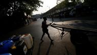 A man pushes his cart along a road near a main market in Colombo, Sri Lanka January 18, 2017. REUTERS/Dinuka Liyanawatte