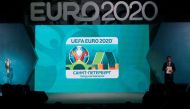 The UEFA EURO 2020 host city Saint Petersburg logo is seen on a screen during its launch in Saint Petersburg on January 19, 2017. The EURO 2020 UEFA European Championship will see matches hosted in 13 cities across Europe, with the semi-finals and final s
