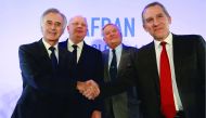 Safran CEO Philippe Petitcolin (left) Shakes hands with Zodiac Aerospace CEO Olivier Zarrouati (right) next to Safran Chairman of board Ross McInnes (second left) and Zodiac Aerospace supervisory Board Chairman Didier Domange at the end of a press confere