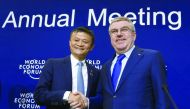 Alibaba Group Founder and Executive Chairman, China's Jack Ma (left) shakes hands with International Olympic Committee (IOC) President Thomas Bach in Davos, Switzerland yesterday.