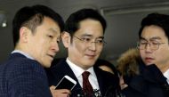 Lee Jae-yong (C) vice chairman of Samsung Electronics, is to be questioned over bribery allegations in the corruption scandal surrounding South Korean President Park Geun-Hye (POOL/AFP).