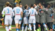 Napoli's midfielder from Italy Lorenzo Insigne celebrates with teammates after scoring a goal during the Italian Serie A football match between AC Milan and Napoli at the San Siro Stadium in Milan on January 21, 2017. / AFP / GIUSEPPE CACACE
