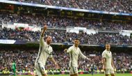 Real Madrid's defender Sergio Ramos (L) celebrates after scoring during the Spanish league football match Real Madrid CF vs Malaga CF at the Santiago Bernabeu stadium in Madrid on January 21, 2017. / AFP / PIERRE-PHILIPPE MARCOU
