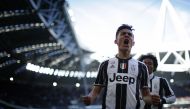 Juventus' forward Paulo Dybala from Argentina celebrates after scoring during the Serie A football match Juventus vs Lazio on January 22, 2017 at the Juventus Stadium in Turin. / AFP / MARCO BERTORELLO
