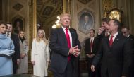 President Donald Trump leaves the President’s Room of the Senate at the Capitol after he formally signed his cabinet nominations into law, in Washington, USA on January 20, 2017. At far right is Chief of Staff Reince Priebus, with White House counsel Dona