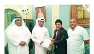 Shamsudheen Olakara (third left), Chairman of Quality Group International receiving the copy of the MoU of Quality Hypermarket in Al Manakh from the sponsor and son of the Deputy Ruler of Sharjah Sheik Khalid bin Ahmed Sultan Al Qasimi.

