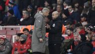 Arsenal manager Arsene Wenger clashes with fourth official Anthony Taylor before being sent to the stands. (Reuters / Dylan Martinez)