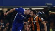 Chelsea's English defender Gary Cahill (L) and Hull City's English midfielder Ryan Mason clash heads during the English Premier League football match between Chelsea and Hull City at Stamford Bridge in London on January 22, 2017.  AFP / Adrian DENNIS 