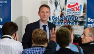 This file photo taken on September 15, 2014 shows the then Alternative fuer Deutschland (AfD) party's main candidate in Thuringia Bjoern Hoecke (C) speaking at a press conference in Berlin, following regional elections in the German states of Brandenburg 