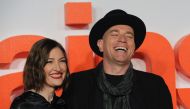 British actor Ewan McGregor (R) poses with British actress Kelly Macdonald (L) on the red carpet arriving to attend the world premiere of the film T2 Trainspotting in Edinburgh on January 22, 2017. / AFP / Andy Buchanan