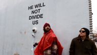 US actor Shia LaBeouf (L) is seen during his 'He Will Not Divide Us' livestream outside the Museum of the Moving Image in Astoria, in the Queens borough of New York January 24, 2017 as a protest against President Donald Trump. AFP / TIMOTHY A. CLARY
