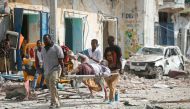 ATTENTION EDITORS - VISUALS COVERAGE OF SCENES OF INJURY - Rescuers carry an unidentified injured man from the scene of an explosion in front of Dayah hotel in Somalia's capital Mogadishu, January 25, 2017. REUTERS/Feisal Omar