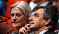 FILE PHOTO - French politician Francois Fillon, member of the conservative Les Republicains political party and his wife Penelope (L) attend a final rally ahead of the first round of vote to choose the conservative candidate for France's presidential elec