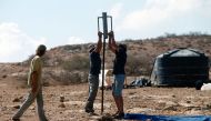 Israeli settlers start to build a new illegal outpost north of the West Bank Palestinian village of Ain al-Baida on October 25, 2016 (AFP) 