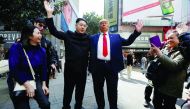 Howard, 37, an Australian-Chinese who is impersonating North Korean leader Kim Jong-un, and Dennis Alan of Chicago, 66, who is impersonating US President Donald Trump, pose on a street in Hong Kong, yesterday.