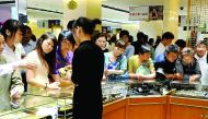 People buying gold jewellery in an outlet in China before the Lunar New Year.