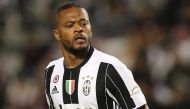 (FILES) This file photo taken on December 23, 2016 shows Juventus' Patrice Evra running during the Italian Super Cup final match between AC Milan and Juventus in Doha. AFP / KARIM JAAFAR
