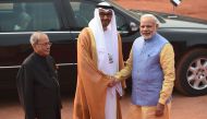 The Crown Prince of Abu Dhabi General Sheikh Mohammed Bin Zayed Al Nahyan (C) with Indian Prime Minister Narendra Modi (R) and Indian President Pranab Mukherjee (L) before a ceremonial reception at the Indian President's house in New Delhi on January 25, 