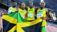 Asafa Powell, Usain Bolt, Michael Frater, Nesta Carter of Jamaica celebrate after winning the gold medal for  Men's 4x100m relay at the National Stadium during the Beijing 2008 Olympic Games in this August 22, 2008 file photo.  Usain Bolt has lost one of 