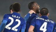 Leicester City's English-born Jamaican defender Wes Morgan (C) celebrates with Leicester City's English midfielder Demarai Gray (L) and Leicester City's English midfielder Danny Drinkwater (R) after scoring their second goal during the English FA Cup four