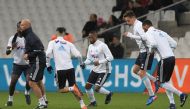 Marseille's new French defender Patrice Evra (C) warms up with teammates before the French L1 football match between Marseille (OM) vs Montpellier (MHSC) at the Velodrome Stadium in Marseille, southern France, on January 27, 2017. / AFP / ANNE-CHRISTINE P