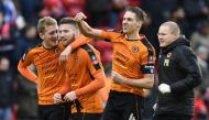 Wolverhampton Wanderers' Welsh midfielder David Edwards (2R) celebrates following the English FA Cup fourth round football match between Liverpool and Wolverhampton Wanderers at Anfield in Liverpool, north west England on January 28, 2017. Wolverhampton w