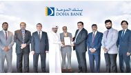 Dr R Seetharaman (centre), Group CEO of Doha Bank along with other senior officials at the award ceremony.