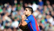 Barcelona's Uruguayan forward Luis Suarez celebrates after scoring a goal during the Spanish league football match Real Betis vs FC Barcelona at the Benito Villamarin stadium in Sevilla on January 29, 2017.The match ended in a draw 1-1 / AFP / CRISTINA QU