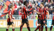 Nice's Italian forward Mario Balotelli (C) celebrates with teammates after scoring a goal during the French L1 football match Nice (OGCN) vs Guingamp (EAG) on January 29, 2017 at the Allianz Riviera stadium in Nice, southeastern France. / AFP / VALERY HAC