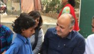 Delhi Deputy Chief Minister Manish Sisodia iinteracting with a student. (Photo: Twitter)
