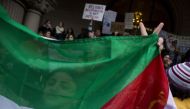 Demonstrators gather near the steps of the Trump Hotel International during a protest on January 29, 2017 in Washington, DC. Protestors in Washington and around the country gathered to protest President Donald Trump's executive order barring the citizens 