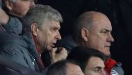 Arsenal's French manager Arsene Wenger (L) gives instructions to the dugout from the director's box during the English FA Cup fourth round football match between Southampton and Arsenal at St Mary's in Southampton, southern England on January 28, 2017. / 
