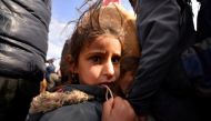 A displaced girl who fled from fighting with Islamic State militants arrives at Hashid Shaabi, or Popular Mobilization Forces (PMF), camp west of Mosul, Iraq January 30, 2017. Picture taken January 30, 2017. REUTERS/Stringer
