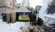 Ukrainian servicemen set tents and make fires to warm local residents of town of Avdiivka (about 20,000 people),Donetsk region after the the town's heating is provided by a coke plant that has been heavily damaged by the falling shells on January 2017. Uk