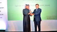 Jamal Al Jamal, deputy CEO of QIIB, receiving the award at a ceremony held in Dubai.