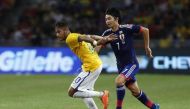 Brazil's Neymar (L) is challenged by Japan's Gaku Shibasaki during a friendly match. (file photo / Reuters)