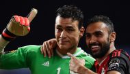 Egypt's goalkeeper Essam El-Hadary (L) and Egypt's midfielder Ahmed Elmohamady celebrate at the end of the penalty shootout of the 2017 Africa Cup of Nations semi-final football match between Burkina Faso and Egypt at the Stade de l'Amitie Sino-Gabonaise 