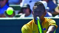 Nick Kyrgios of Australia hits a return against Jan Satral of the Czech Republic during their Davis Cup world group first round match at Kooyong in Melbourne yesterday. 