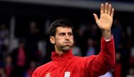 Serbia's tennis player Novak Djokovic reacts after winning against Russia's tennis player Daniil Medvedev during the Davis Cup World Group first round singles tennis match between Serbia and Russia at Cair sports hall in Nis, on February 3, 2017. AFP / AN