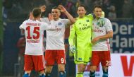 This picture taken on February 3, 2017 shows Hamburg's Greek defender Kyriakos Papadopoulos (2nd L) celebrating with team mates after the German first division Bundesliga football match between Hamburger SV and Bayer 04 Leverkusen in Hamburg, northern Ger