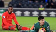 Liverpool's English striker Daniel Sturridge (L) reacts after missing a chance during the English Premier League football match between Hull City and Liverpool at the KCOM Stadium in Kingston upon Hull, north east England on February 4, 2017. Hull won the