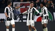 Juventus' Colombian midfielder Juan Cuadrado (L) celebrates with teammates Argentinian forward Paulo Dybala (C) and Bosnian midfielder Miralem Pjanic (L) during the Italian Serie A football match between Juventus and Inter Milan on February 5, 2017 at the