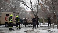 Afghan security personnel stand guard at the site of a suicide blast near the Afghan Supreme Court in Kabul on February 7, 2017.  AFP / WAKIL KOHSAR
