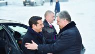 Ukrainian President Petro Poroshenko (right) welcomes Greek Prime Minister Alexis Tsipras prior to their talks in Kiev, yesterday. Tsipras is in Ukraine for a two-day working visit. 
