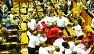 Security officials force out South African opposition party Economic Freedom Fighters members during South African President's speech for the State Of the Nation Address in Cape Town.