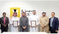 MEEZA Executive Team members receive certifications from SGS representative.