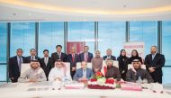 Waleed Al Sayed (second right), Chief Executive Officer of Ooredoo Qatar;  Joseph Abraham (centre), CEO of Commercial Bank and other senior officials at the signing ceremony held at Commercial Bank Plaza.