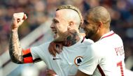 Roma's Belgian midfielder Radja Nainggolan (L) celebrates after scoring with teammate Roma's Brazilian defender Bruno Peres during the Italian Serie A football match FC Crotone vs AS Roma on February 12, 2017 at the Ezio Scida Stadium / AFP / CARLO HERMAN