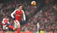Arsenal's German midfielder Mesut Ozil chases the ball during the English Premier League football match between Arsenal and Hull City at the Emirates Stadium in London on February 11, 2017. AFP / Glyn Kirk